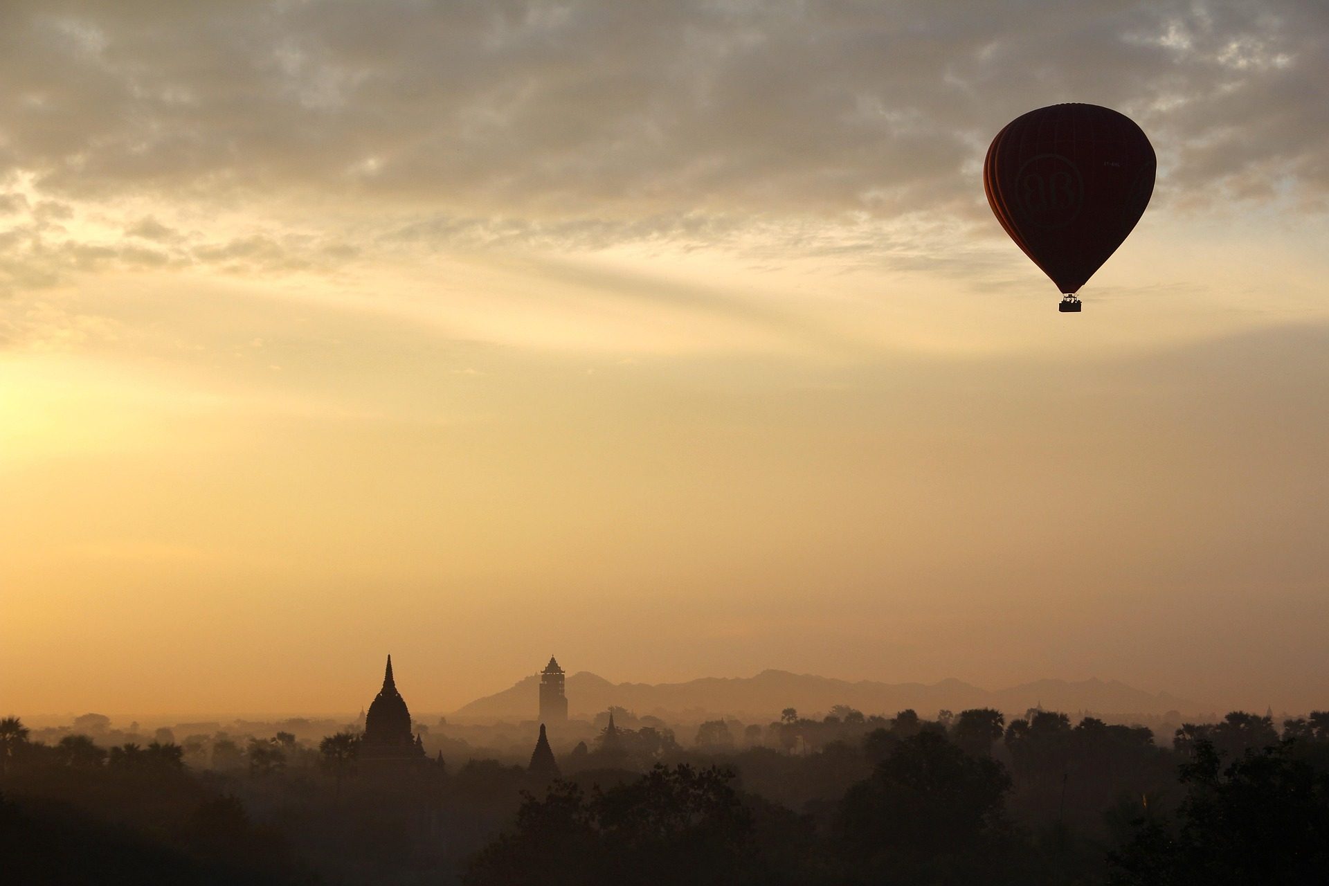 Hot air balloon over Bagan pagodas at sunrise, Myanmar
