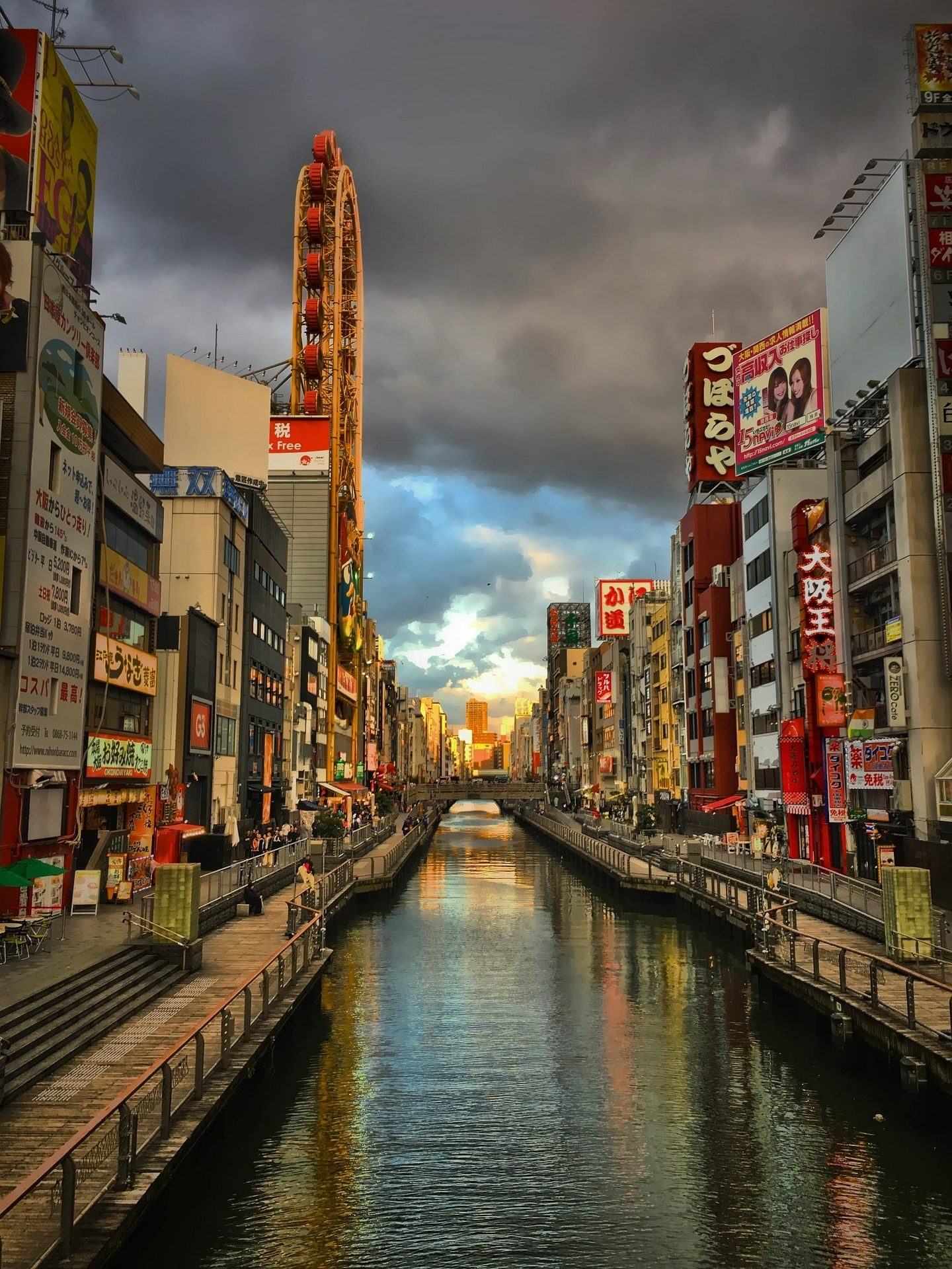 Dotonbori canal at sunset with Ferris wheel reflection, Osaka